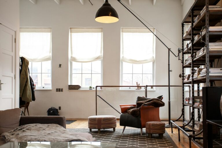 black floor lamp beside sofa chair
